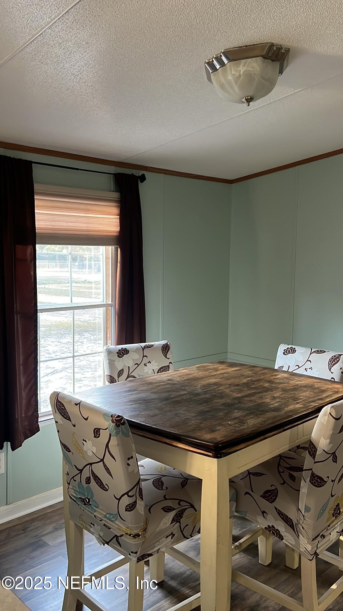 85182 Lonnie Crews Road Fernandina Beach, FL 32034 - Photo 4 of 15 a view of a dining room with furniture and window
