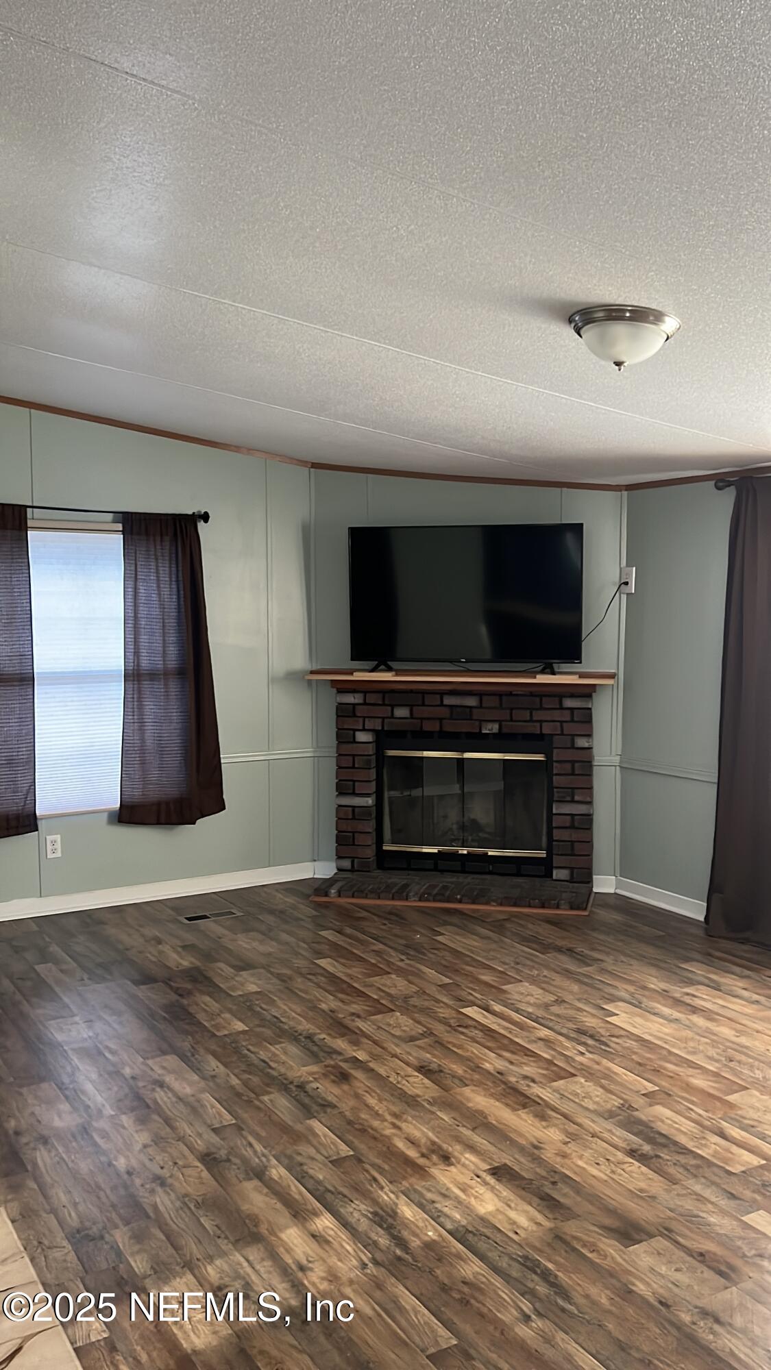 85182 Lonnie Crews Road Fernandina Beach, FL 32034 - Photo 5 of 15 a view of kitchen with microwave and stove
