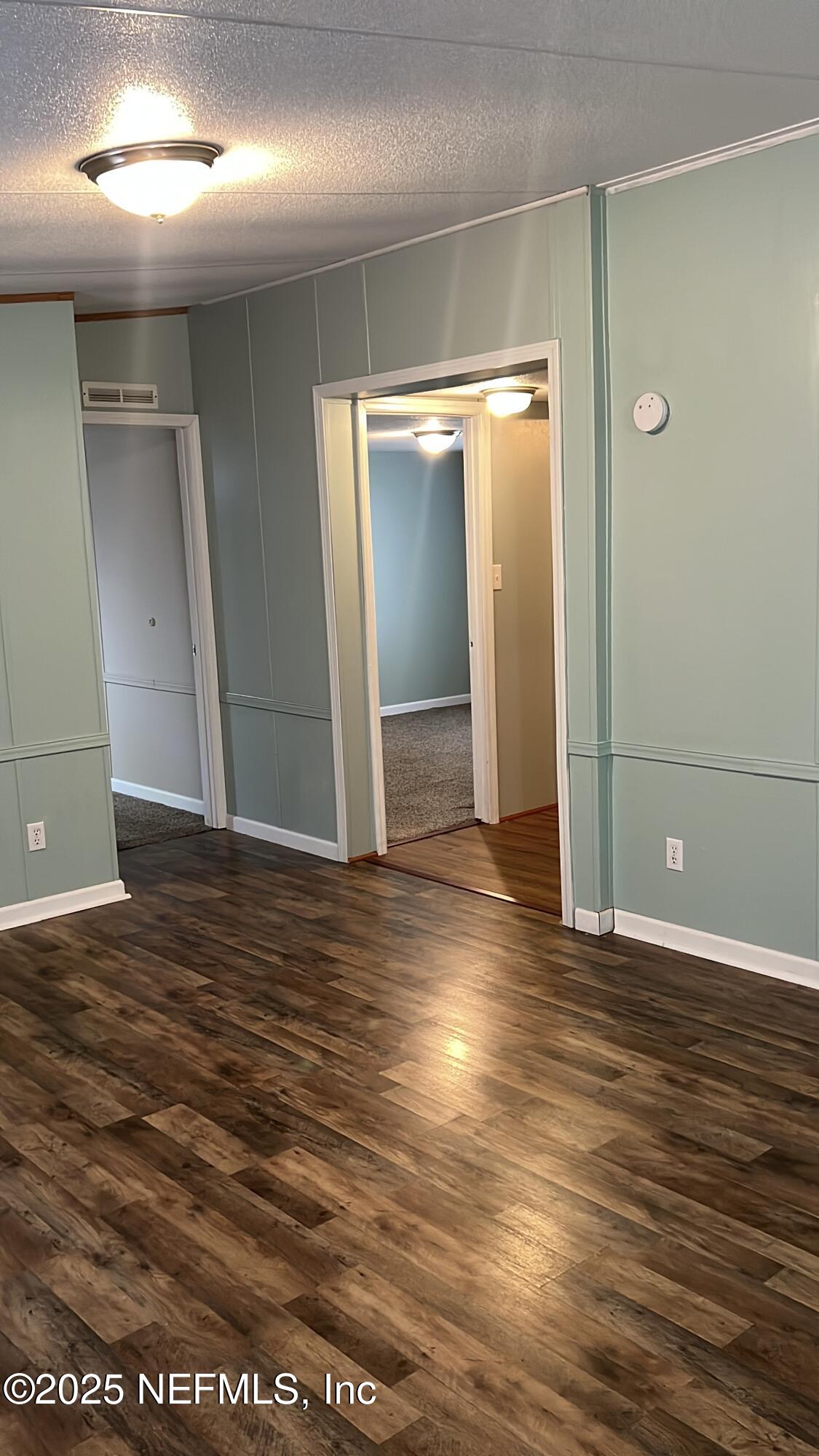 85182 Lonnie Crews Road Fernandina Beach, FL 32034 - Photo 7 of 15 an empty room with wooden floor and closet