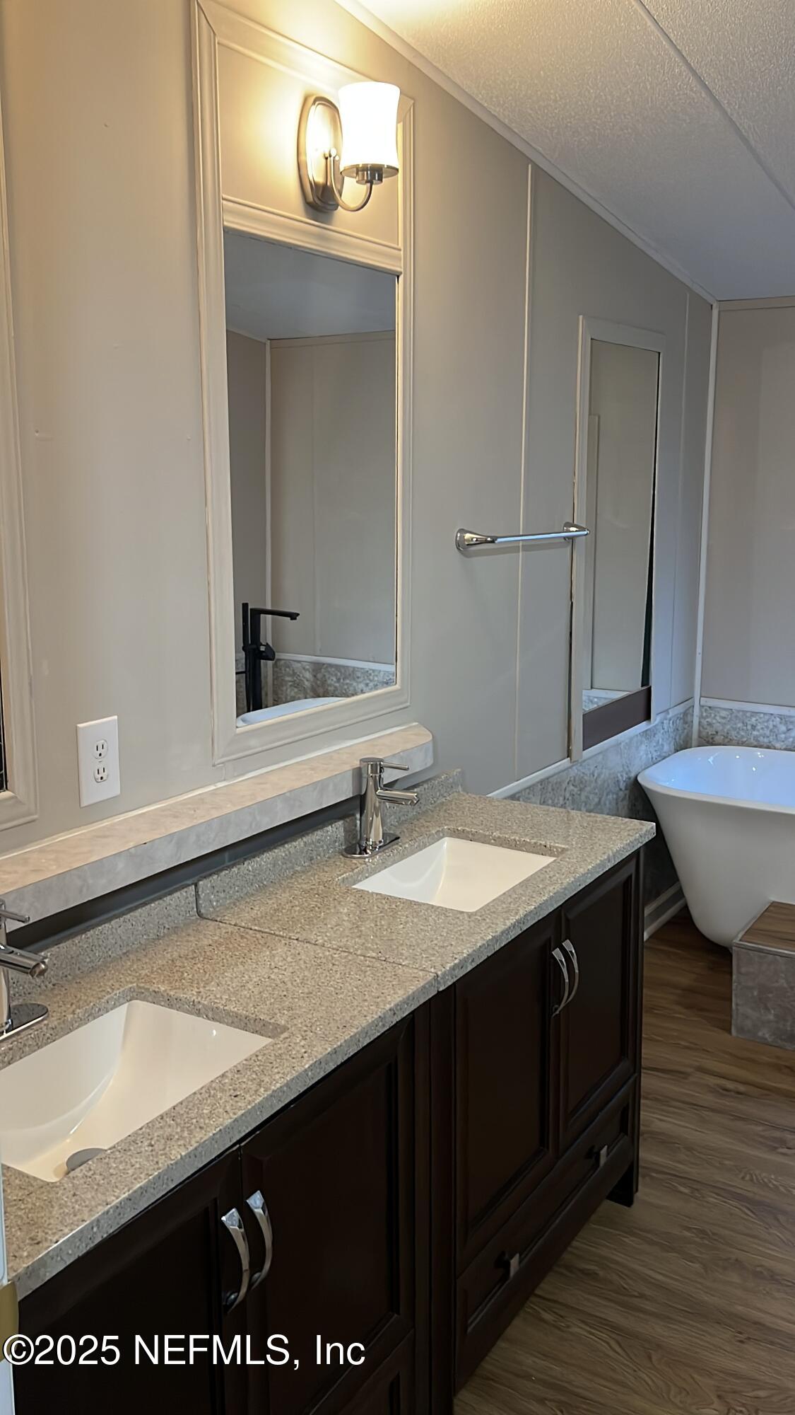 85182 Lonnie Crews Road Fernandina Beach, FL 32034 - Photo 9 of 15 a bathroom with a sink and a mirror