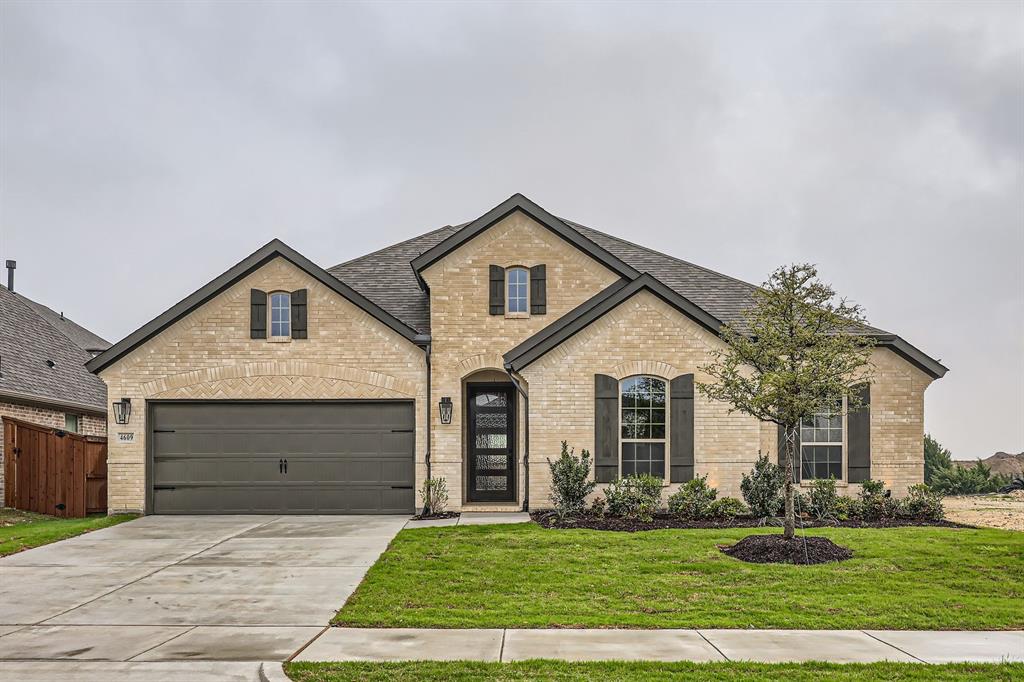 4609 Timberdrift Street Midlothian, TX 76065 - Photo 1 of 1 French country home with driveway, brick siding, a garage, and a front yard