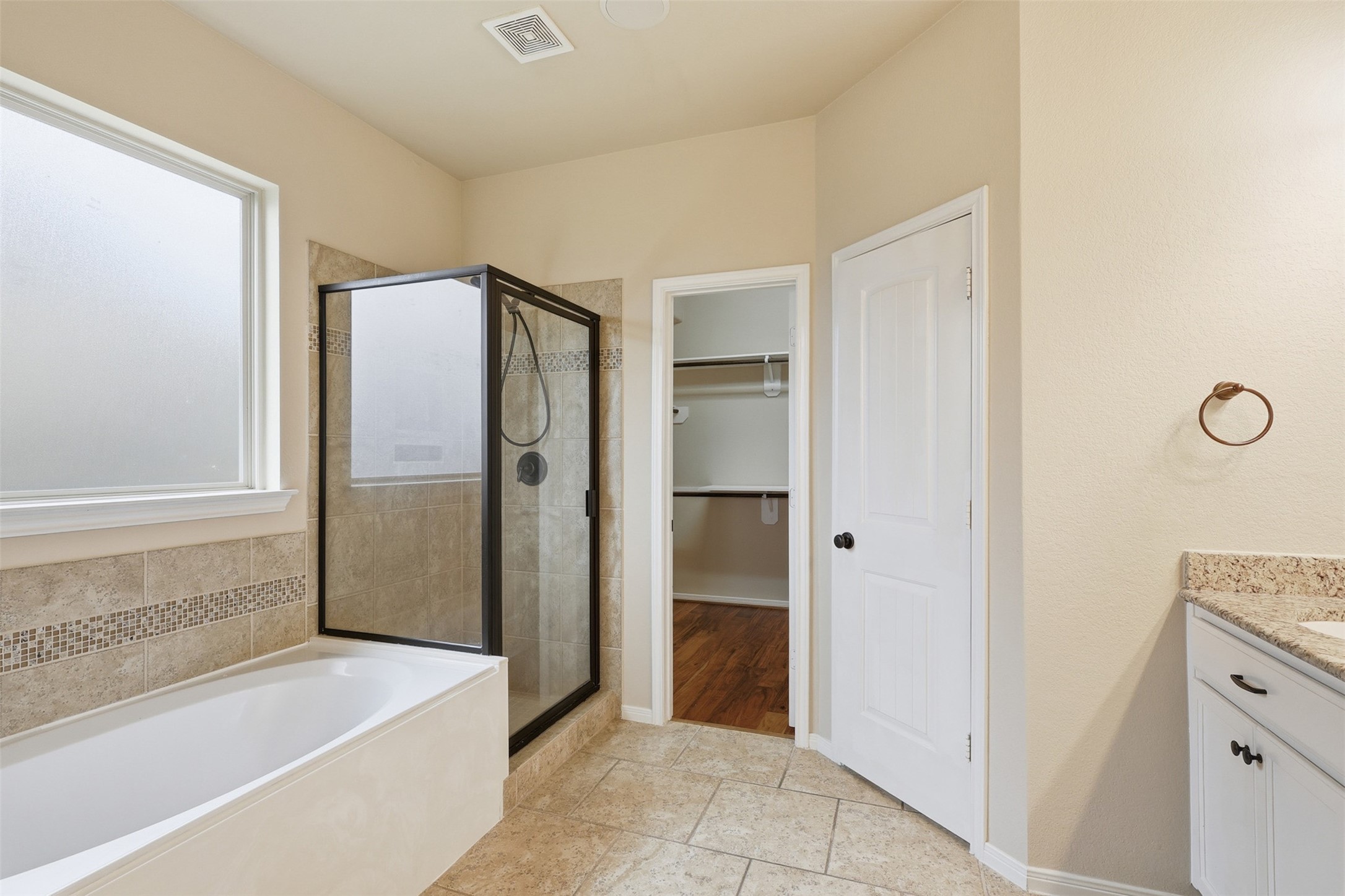 22943 Dale River Road Tomball, TX 77375 - Photo 17 of 29 a bathroom with a bathtub and a shower