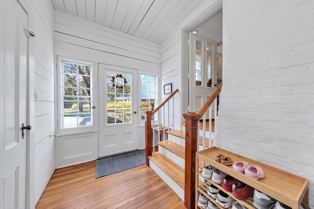 505 Essex Street Hamilton, MA 01982 - Photo 13 of 37 a view of an entryway with wooden floor and windows