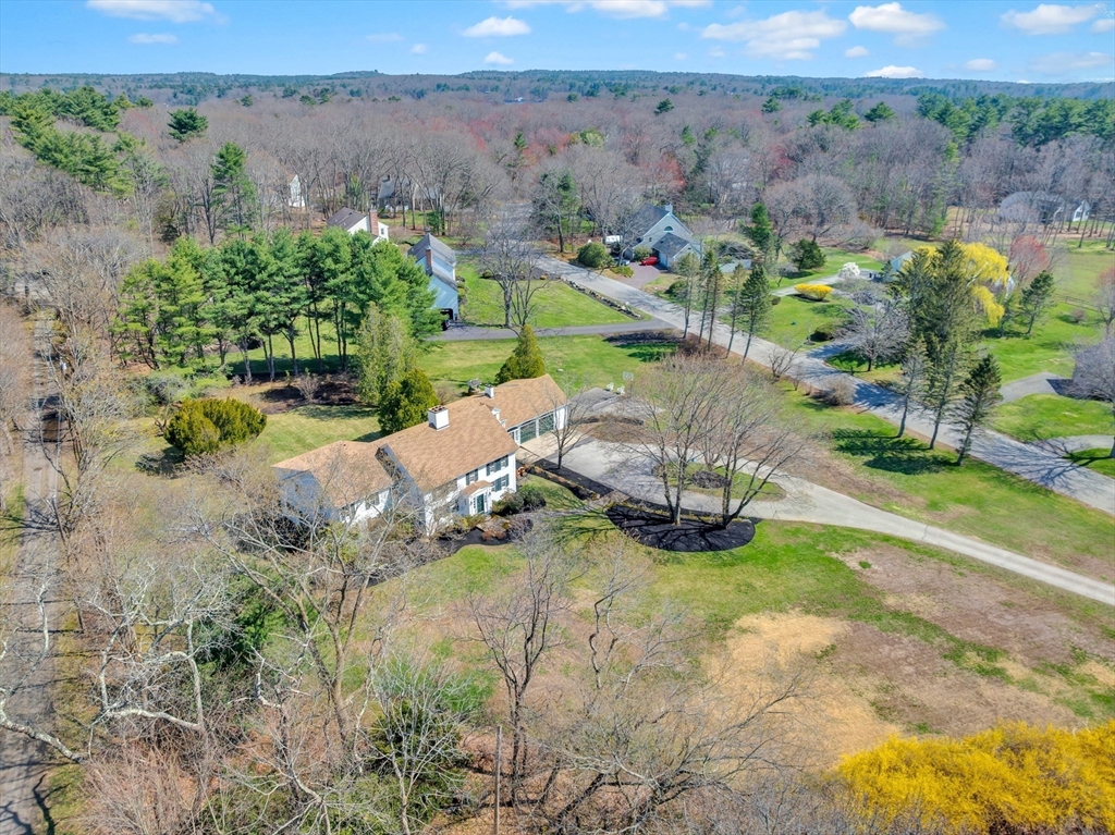 505 Essex Street Hamilton, MA 01982 - Photo 2 of 37 an aerial view of a house with a yard and lake view