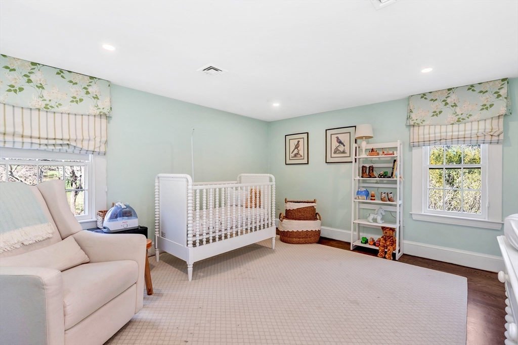505 Essex Street Hamilton, MA 01982 - Photo 25 of 37 a bedroom with furniture and a window