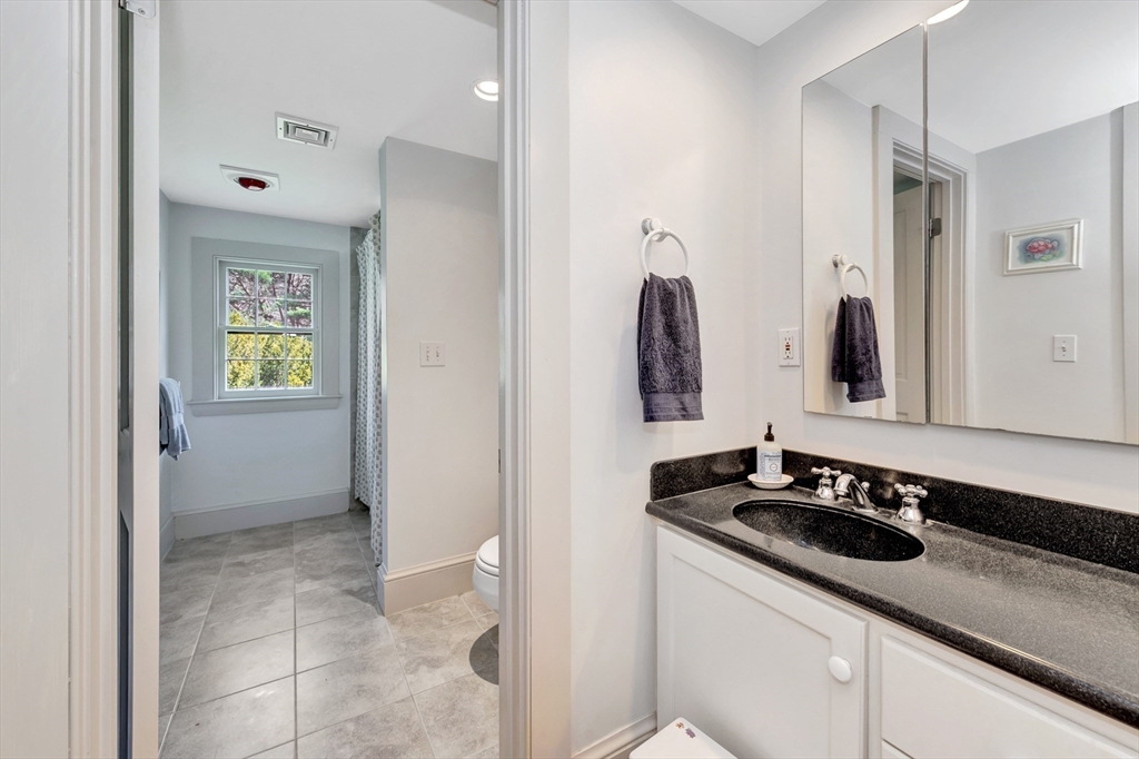 505 Essex Street Hamilton, MA 01982 - Photo 26 of 37 a bathroom with a sink and a mirror