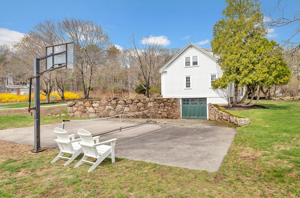 505 Essex Street Hamilton, MA 01982 - Photo 34 of 37 a view of a house with a yard and wooden fence
