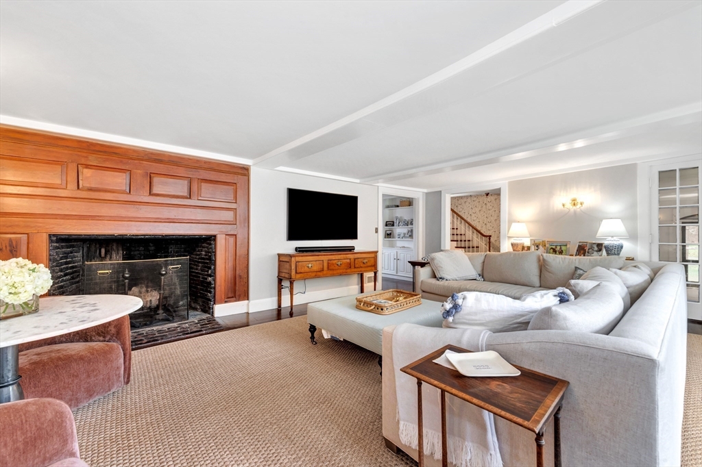 505 Essex Street Hamilton, MA 01982 - Photo 5 of 37 a living room with furniture large window and a fireplace
