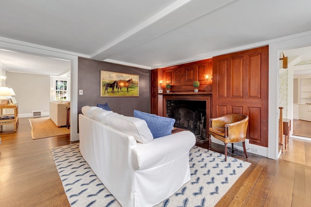 505 Essex Street Hamilton, MA 01982 - Photo 6 of 37 a living room with furniture and a fireplace