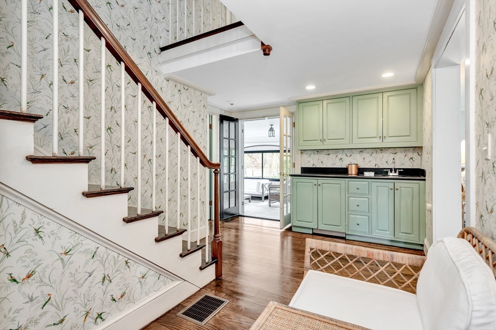 505 Essex Street Hamilton, MA 01982 - Photo 8 of 37 a view of an entryway with wooden floor and stairs
