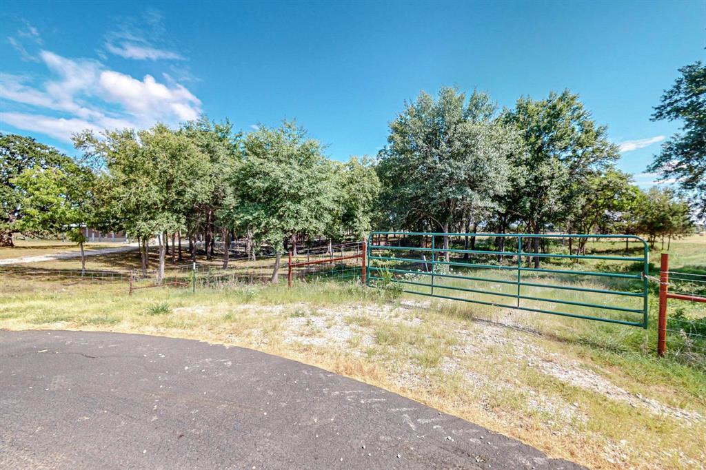 637 Lyman T Davis Road Corsicana, TX 75110 - Photo 23 of 34 a view of swimming pool with outdoor seating and trees in the background