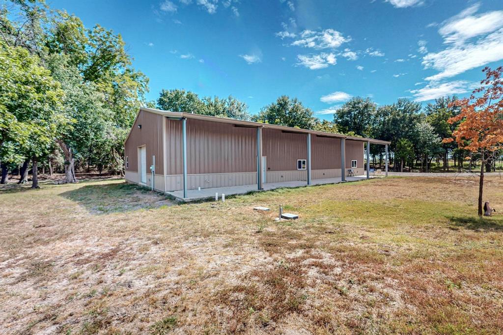 637 Lyman T Davis Road Corsicana, TX 75110 - Photo 28 of 34 a backyard of a house with lots of green space
