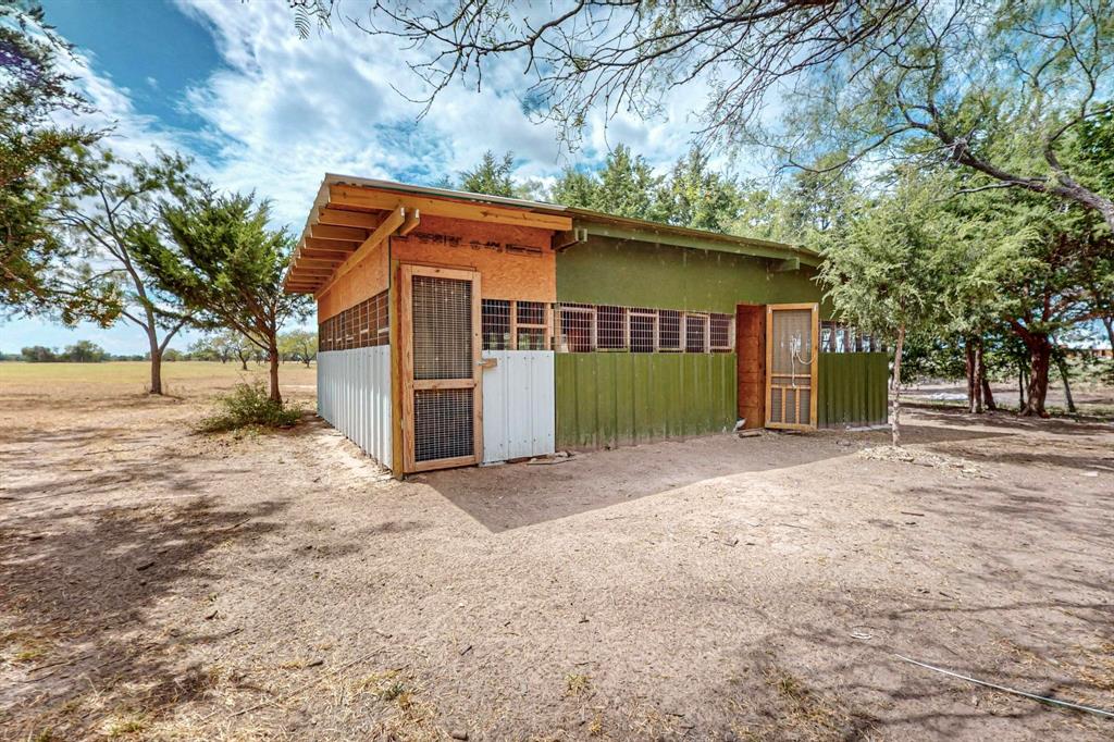 637 Lyman T Davis Road Corsicana, TX 75110 - Photo 34 of 34 a view of a house with a yard and garage