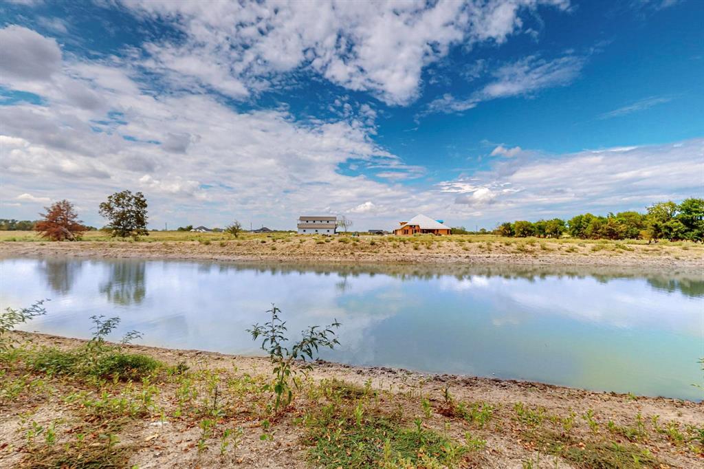 637 Lyman T Davis Road Corsicana, TX 75110 - Photo 6 of 34 a view of a lake with a beach