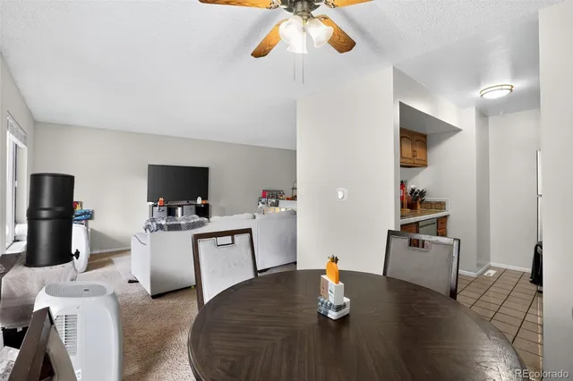 a living room with furniture and flat screen tv