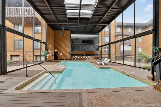 a view of swimming pool with yard