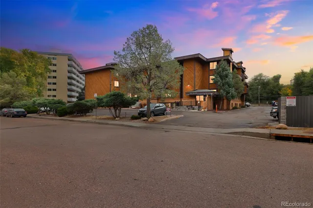 a view of a street with cars on the road