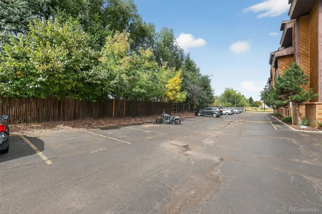 a view of street and with car parked on road