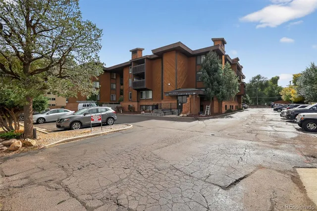 a view of street with parked cars