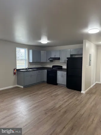 a view of kitchen with wooden floor