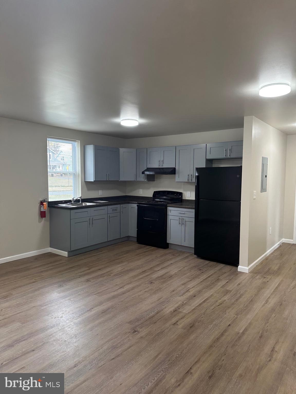 a view of kitchen with wooden floor