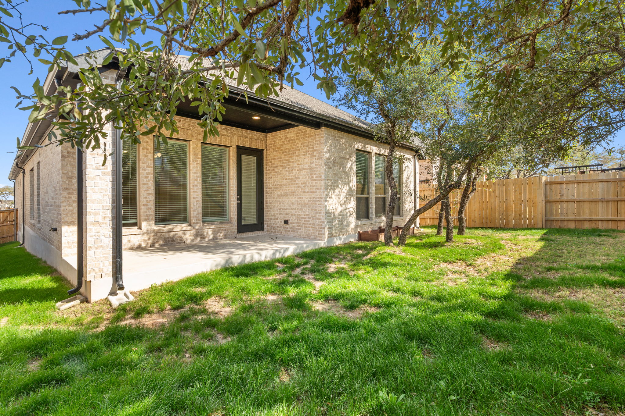 701 Tradewinds Way Georgetown, TX 78628 - Photo 2 of 40 a backyard of a house with lots of green space