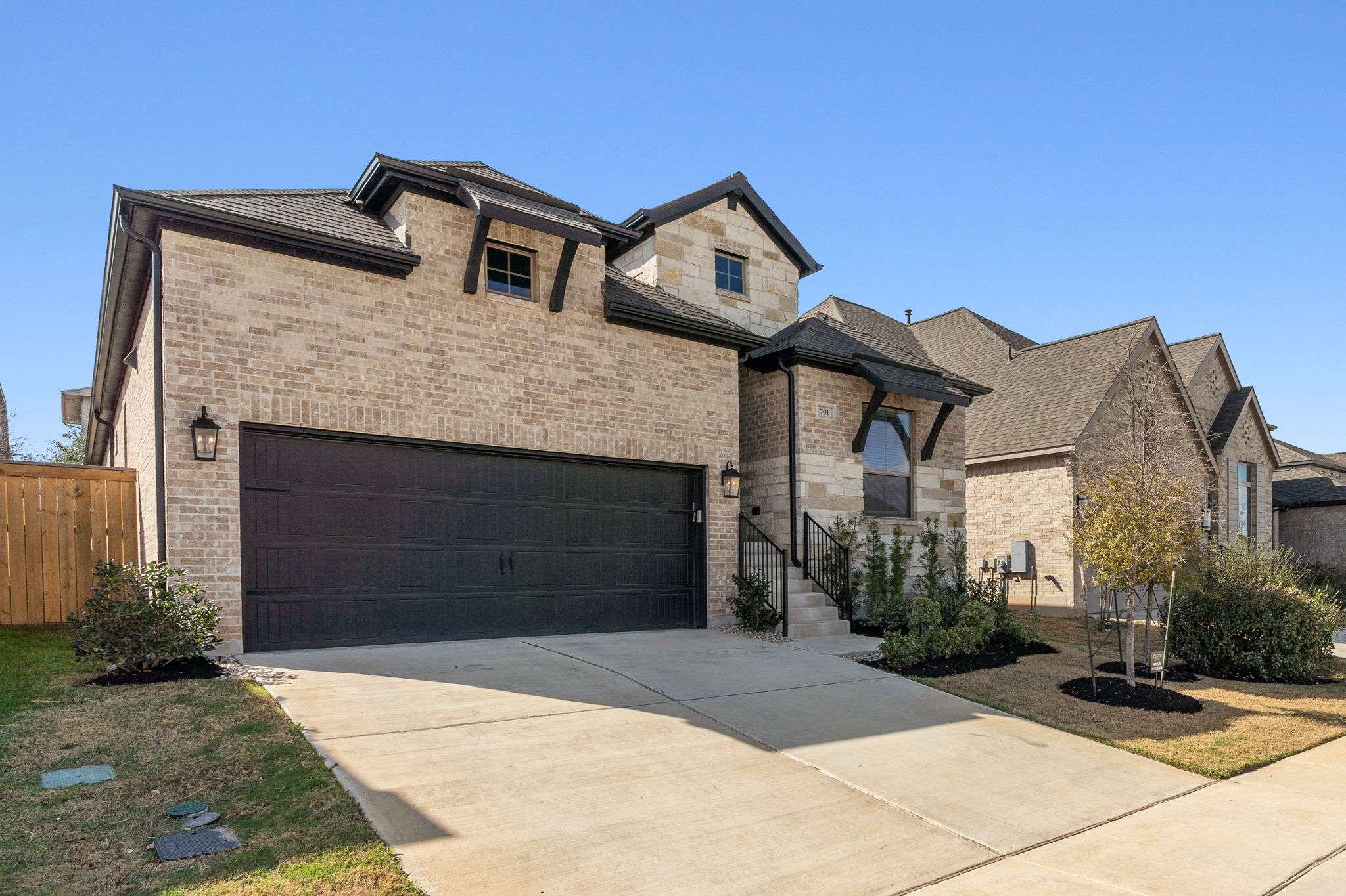 701 Tradewinds Way Georgetown, TX 78628 - Photo 34 of 40 a front view of a house with a yard and garage