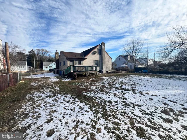 a view of a backyard with large trees