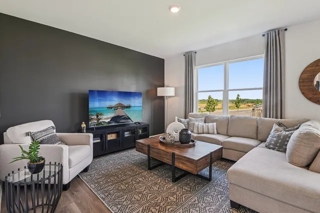 a living room with furniture and a couch