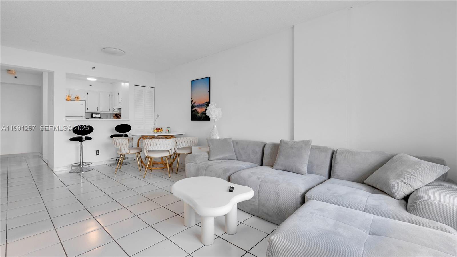 546 Southwest 1st Street, Unit 603 Miami, FL 33130 - Photo 3 of 14 a living room with furniture and white walls