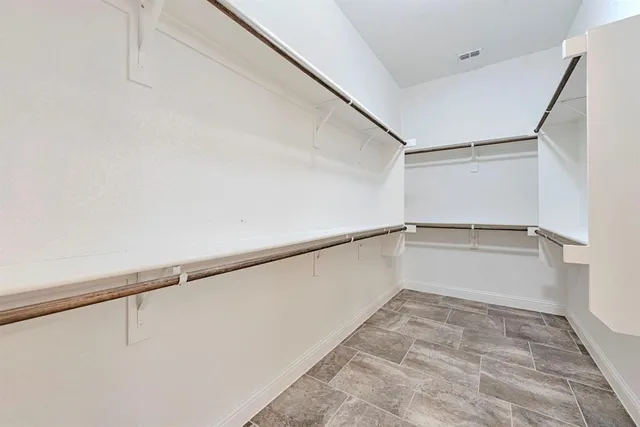 a view of an empty walk in closet