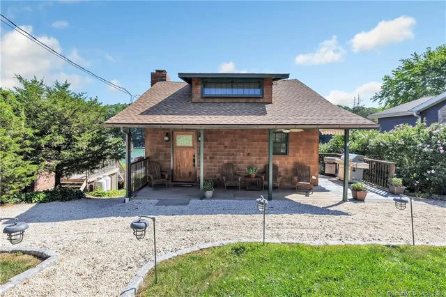 a front view of a house with garden