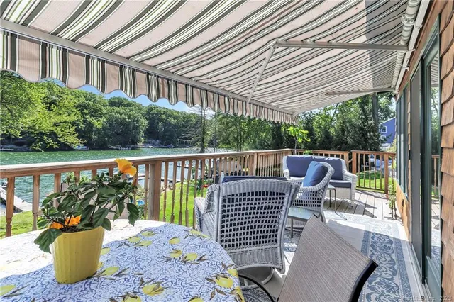 a view of a two chairs and table in the balcony