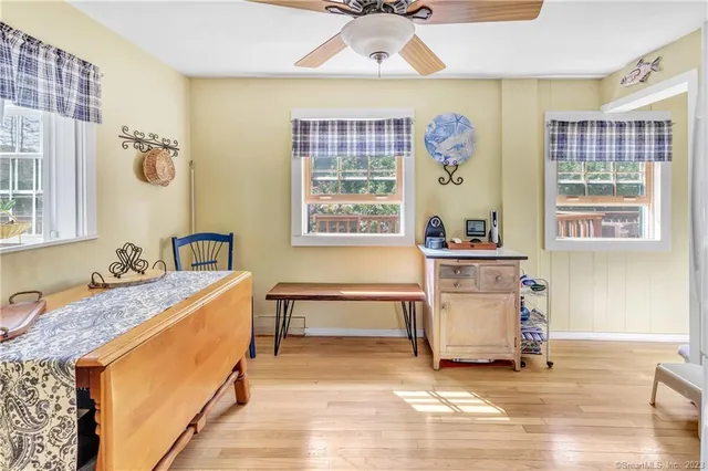a spacious bedroom with a bed and a window