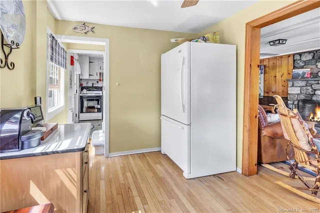 a kitchen with a refrigerator and a sink