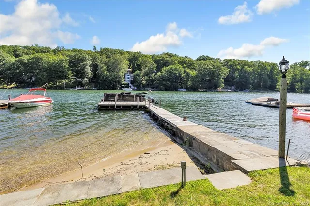a view of a swimming pool with a yard