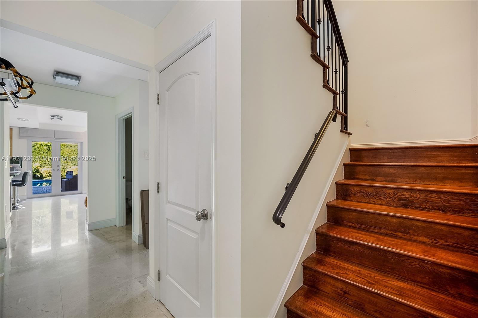 10670 Southwest 77th Avenue, Unit 10670 Pinecrest, FL 33156 - Photo 11 of 28 a view of entryway and hall with wooden floor