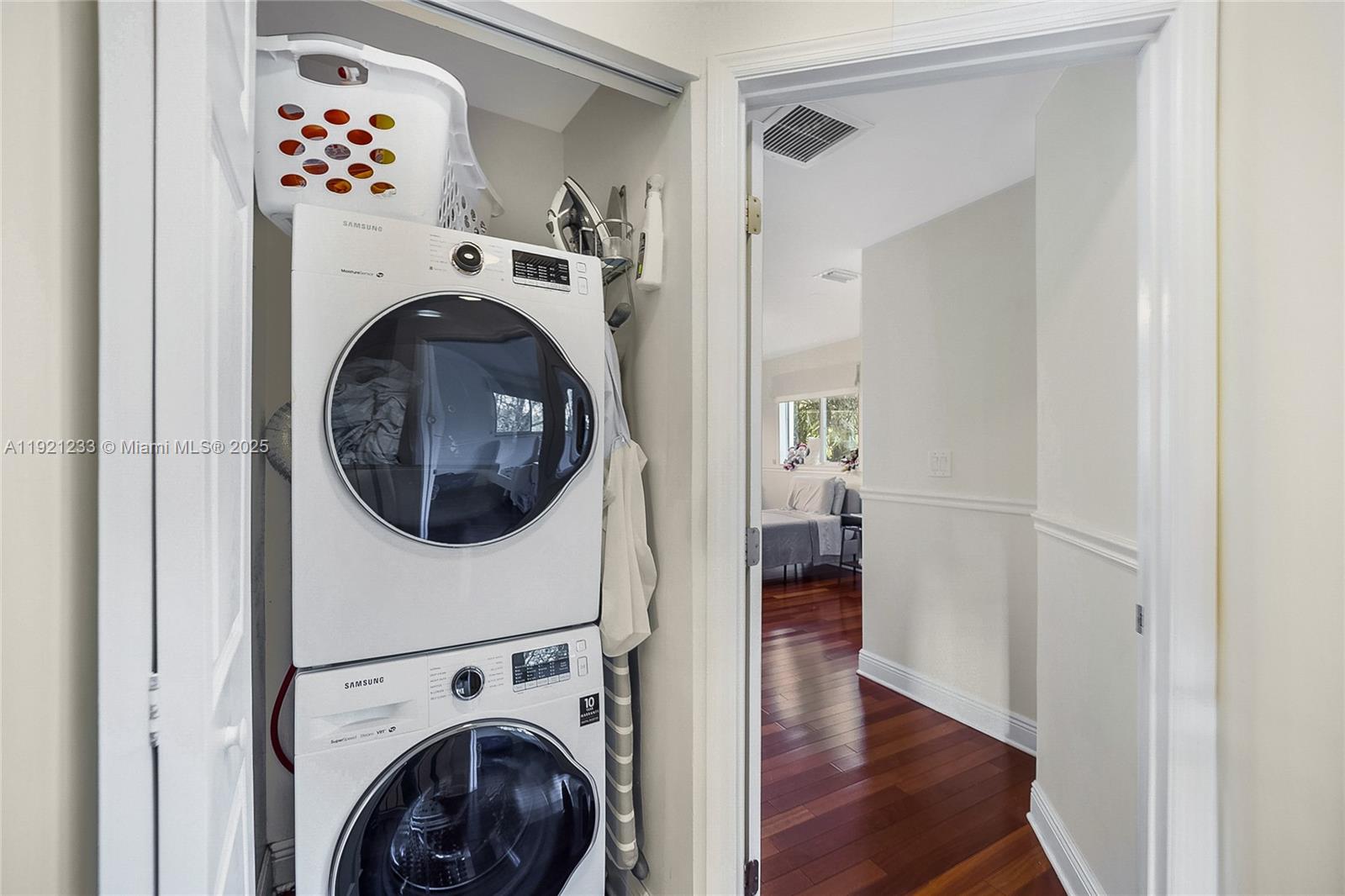 10670 Southwest 77th Avenue, Unit 10670 Pinecrest, FL 33156 - Photo 18 of 28 a view of a hallway with washer and dryer