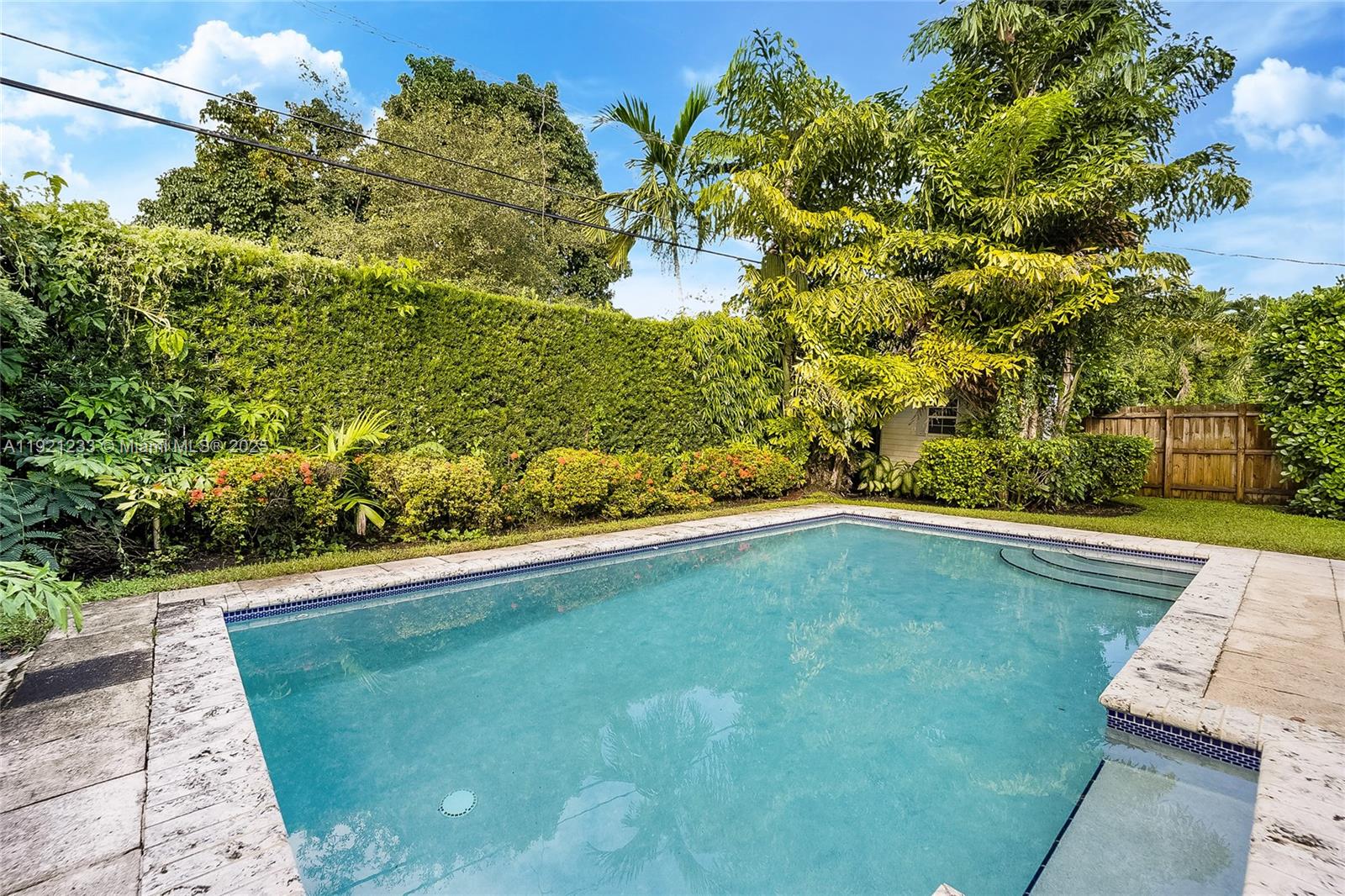 10670 Southwest 77th Avenue, Unit 10670 Pinecrest, FL 33156 - Photo 26 of 28 a view of a swimming pool with a yard