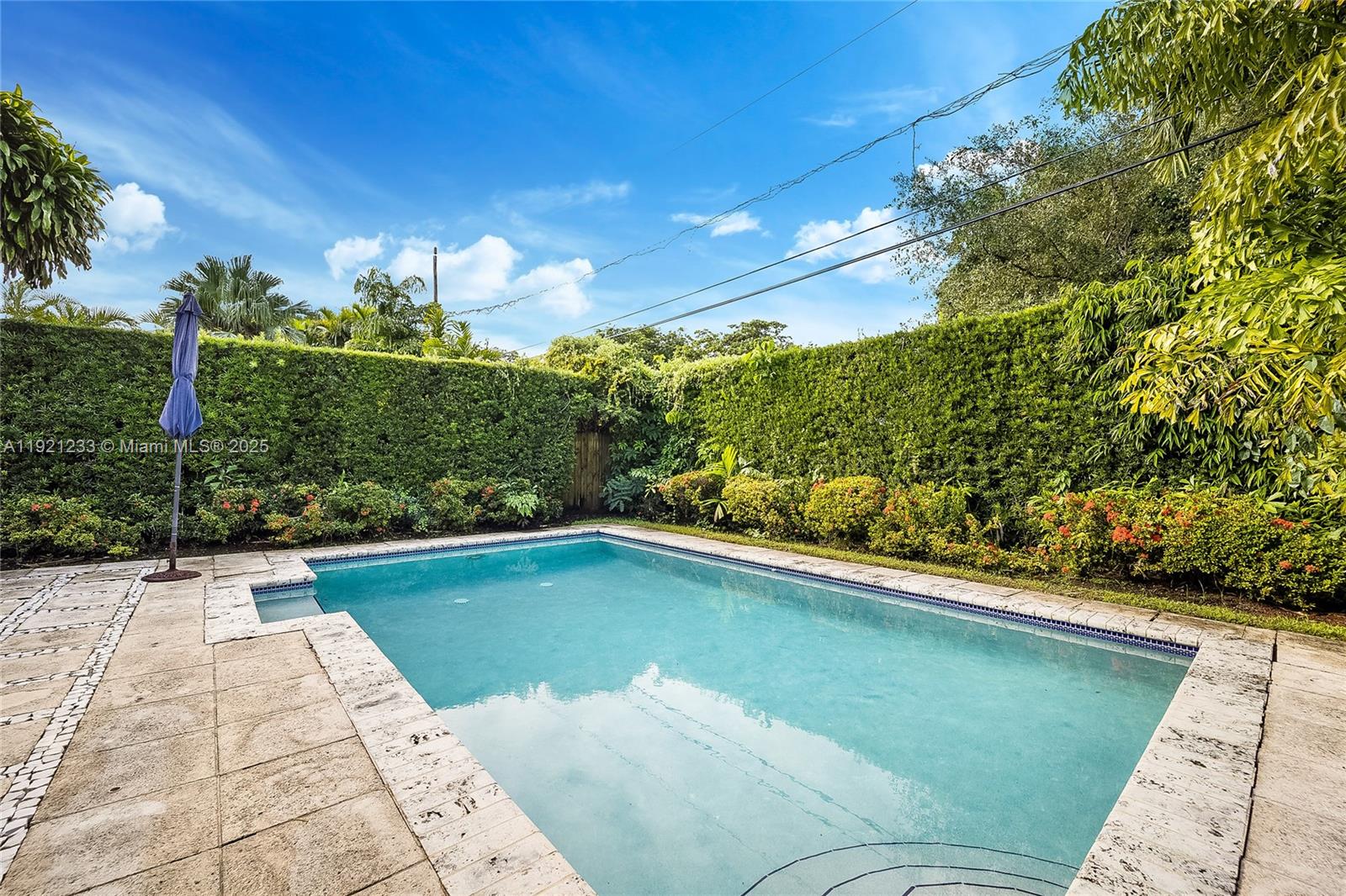 10670 Southwest 77th Avenue, Unit 10670 Pinecrest, FL 33156 - Photo 27 of 28 a view of a swimming pool and outdoor seating