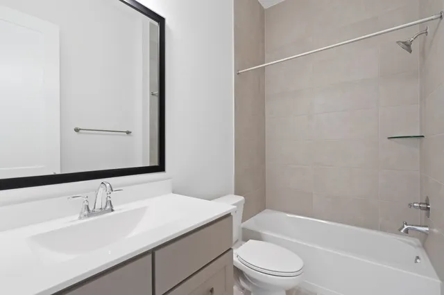 a view of a kitchen with a sink and a refrigerator