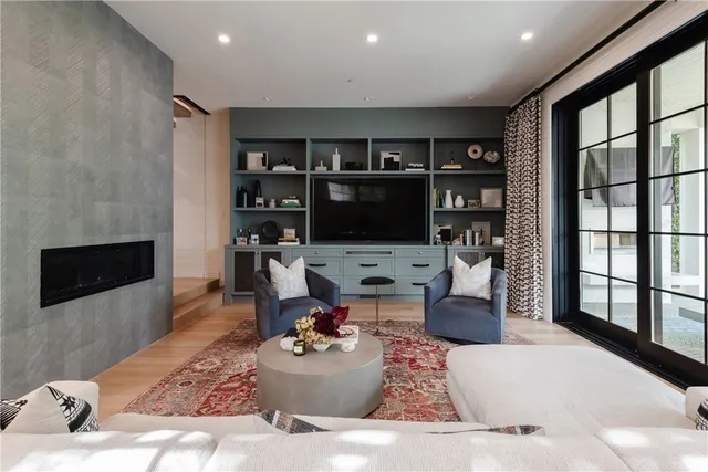 a living room with furniture and a fireplace