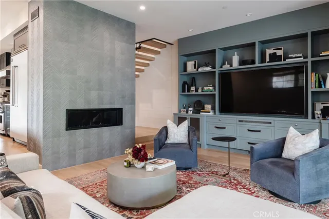 a view of living room filled with furniture and a potted plant