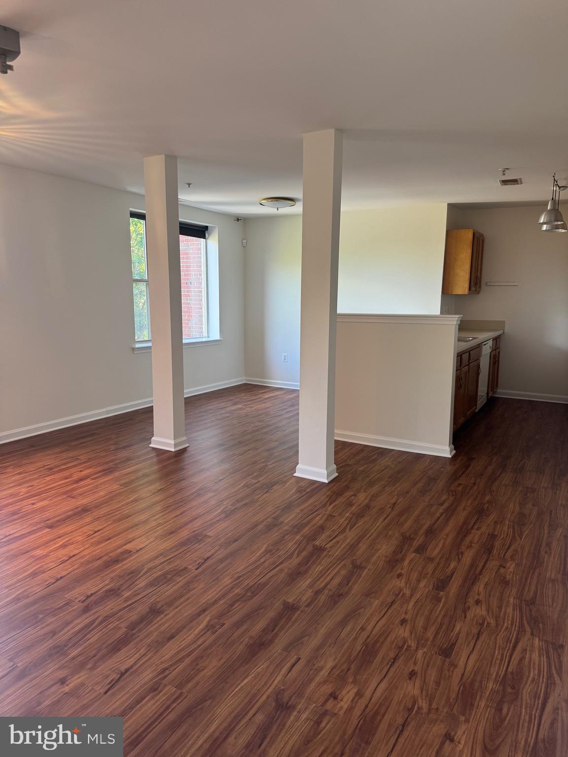 1210 Perry Street Northeast, Unit 202 Washington, DC 20017 - Photo 11 of 30 a view of empty room with wooden floor