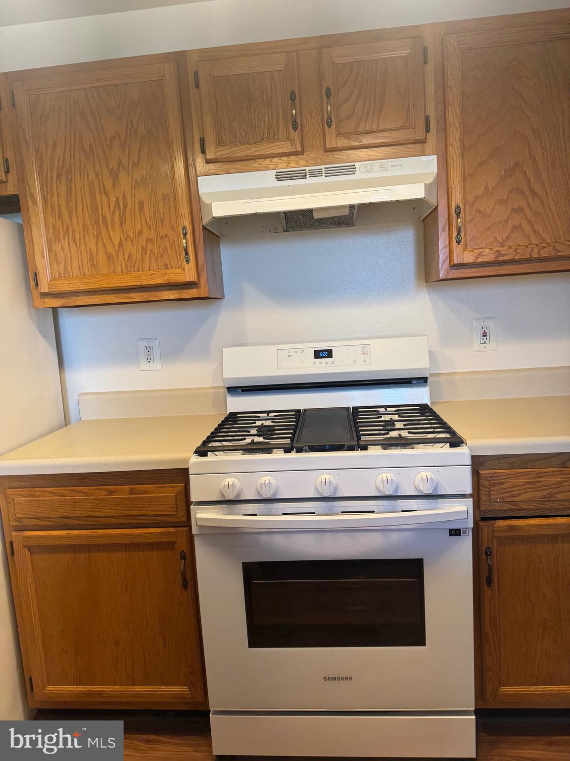 1210 Perry Street Northeast, Unit 202 Washington, DC 20017 - Photo 12 of 30 a stove top oven sitting inside of a kitchen