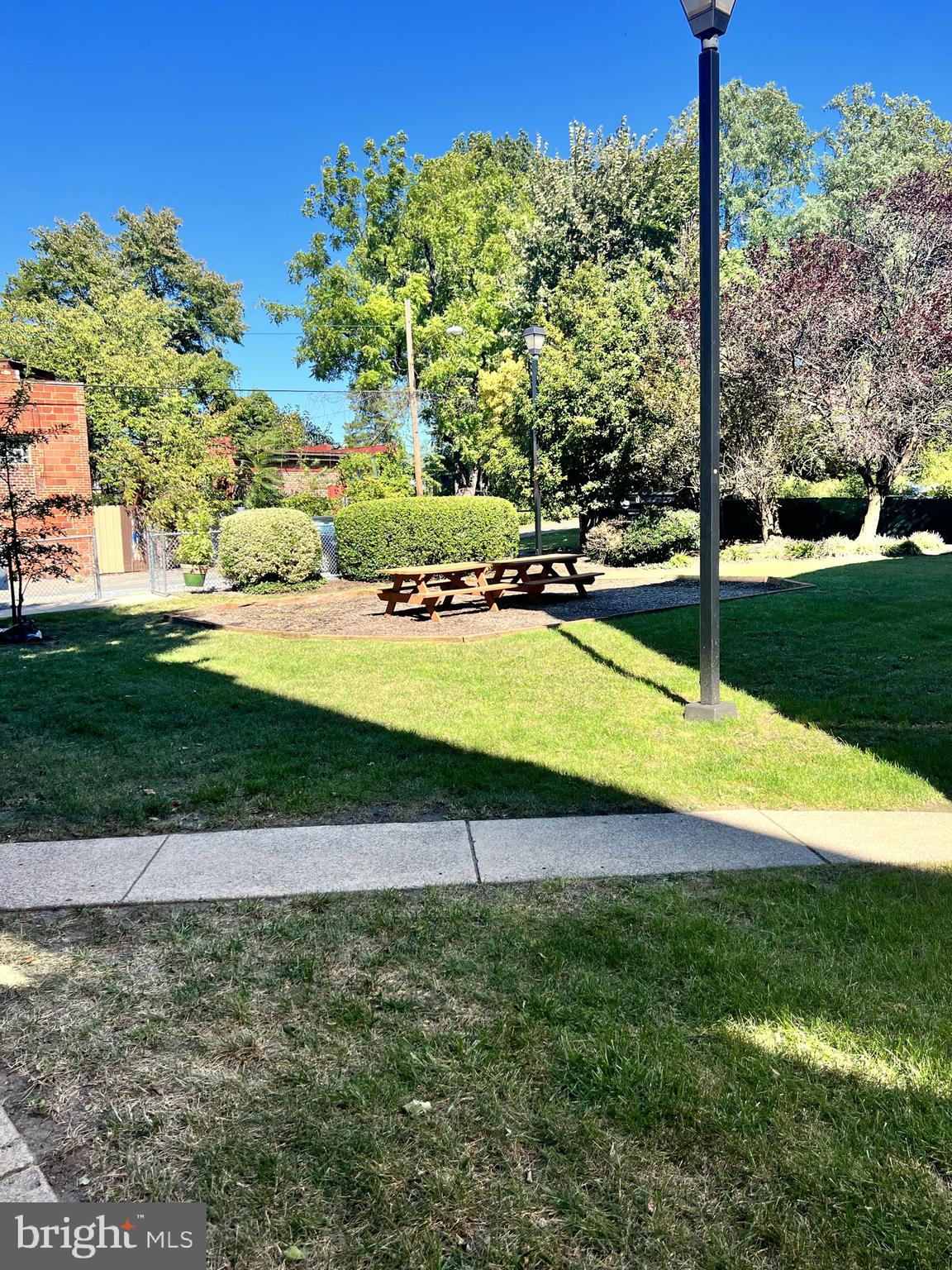 1210 Perry Street Northeast, Unit 202 Washington, DC 20017 - Photo 28 of 30 a swimming pool with lots of green space