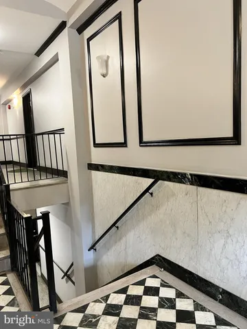 a view of staircase with a rug