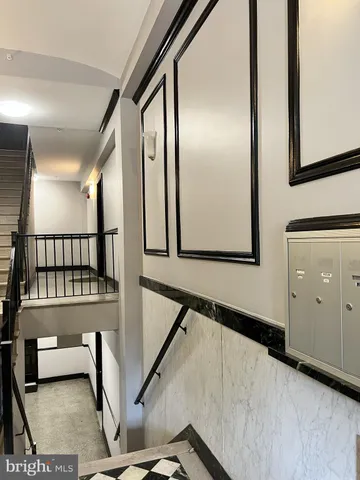 a view of a hallway with staircase