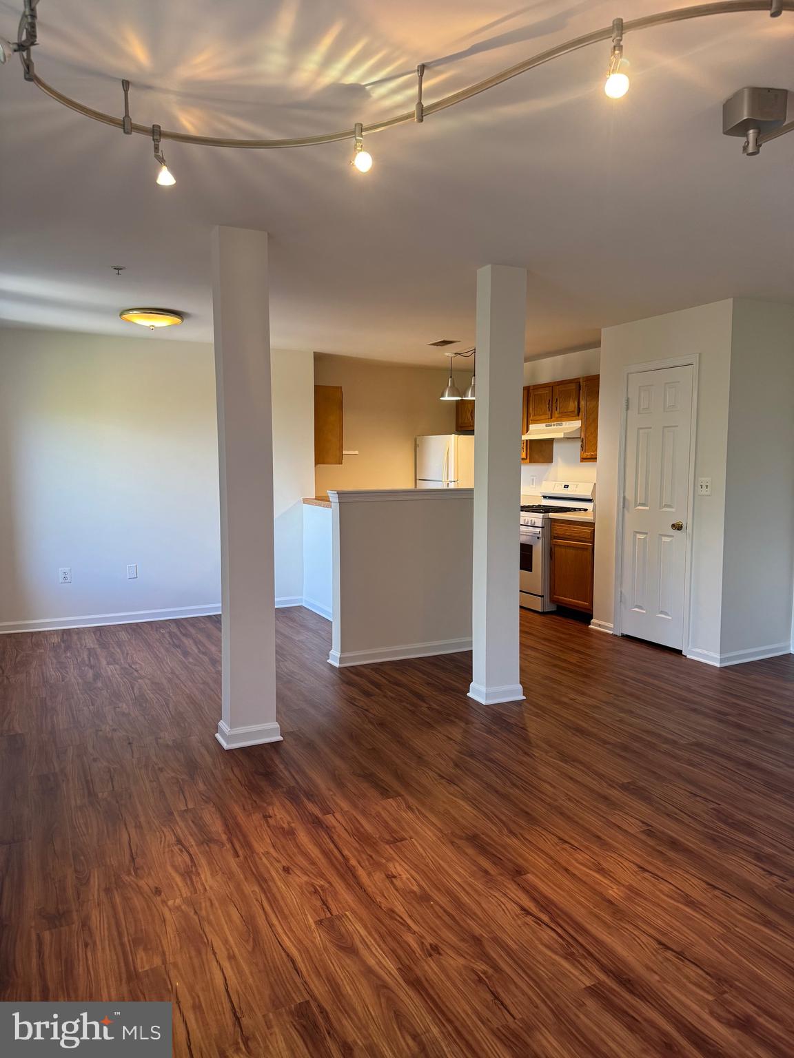 1210 Perry Street Northeast, Unit 202 Washington, DC 20017 - Photo 6 of 30 a view of a big room with wooden floor and windows