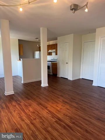 a view of a livingroom with wooden floor